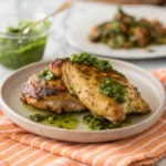 Chimichurri chicken air fryer recipe served with vibrant chimichurri sauce over crispy air-fried chicken.