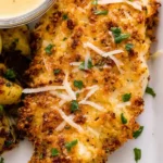 Golden air fryer parmesan crusted chicken on a plate