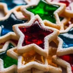 A close-up pile of colorful, star-shaped Stained glass cookies dusted with powdered sugar.