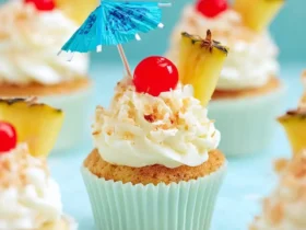 Pina Colada Cupcakes 49 Pina Colada Cupcakes topped with whipped cream, toasted coconut, pineapple wedges, cherries, and tiny blue umbrellas.