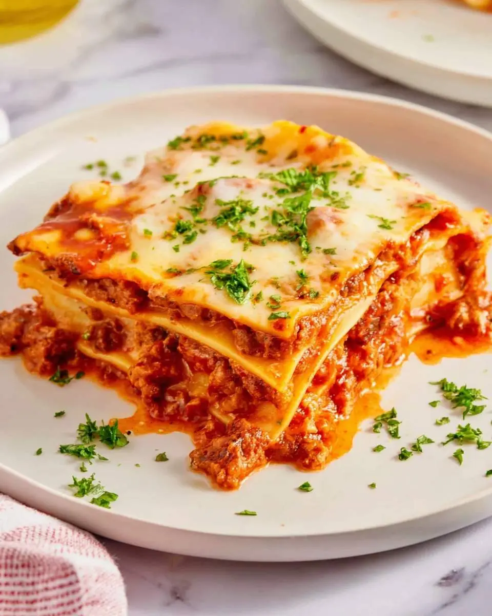 Ravioli Lasagna 26 layered ravioli lasagna in a glass baking dish showing distinct cheese and sauce layers