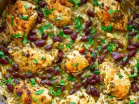 Salsa Verde Chicken, Rice, and Beans cooked together in one skillet, topped with fresh cilantro.